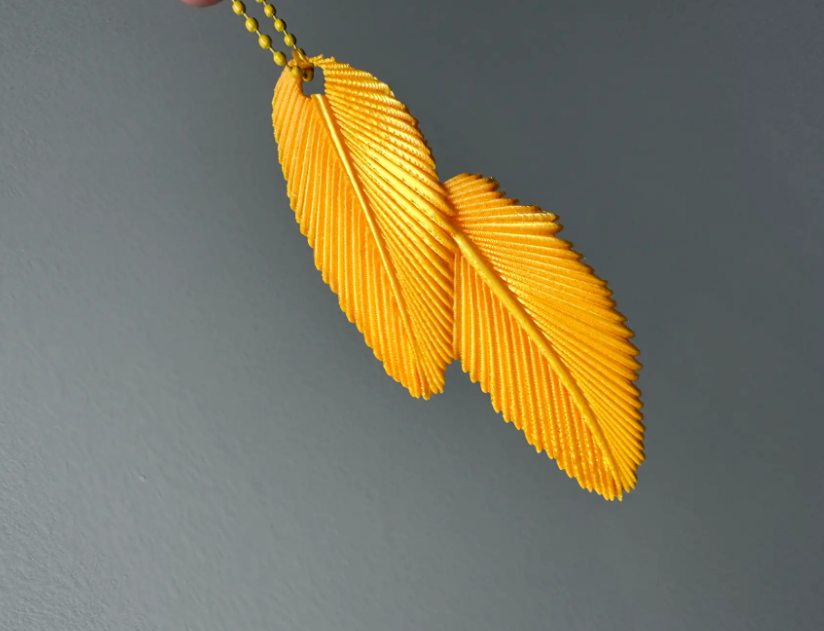 Gold feather pendant