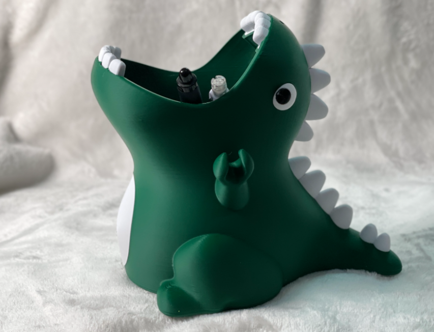 Cute little dinosaur pencil holder