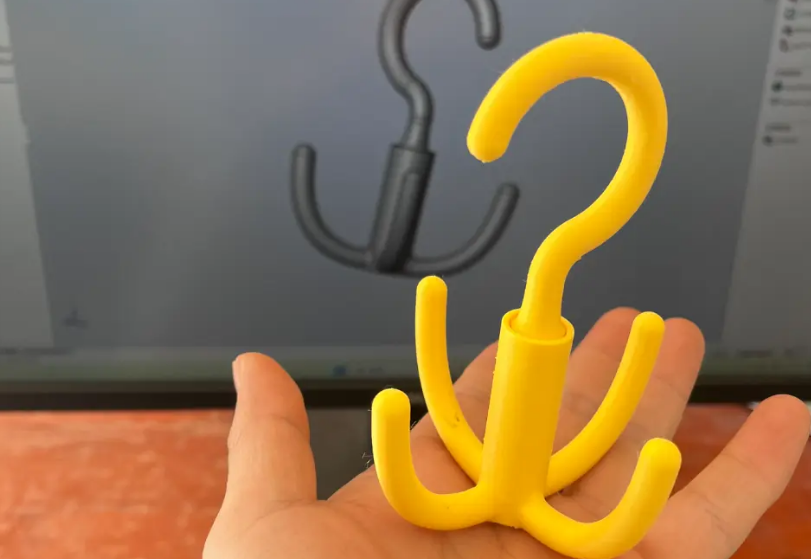 Integrated printing rotating hook