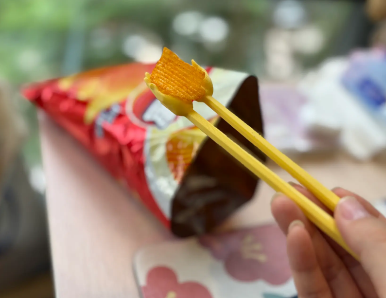 Pious little hand chopsticks